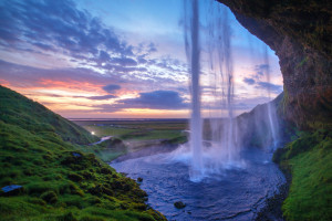 Seljalandfoss waterfall at sunset, Iceland. Horizontal shot.