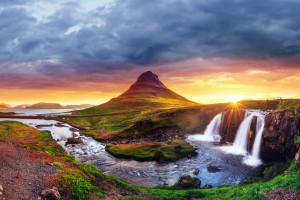 The picturesque sunset over landscapes and waterfalls. Kirkjufell mountain,Iceland