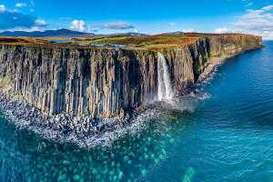 Aerial view of the dramatic coastline at the cliffs by Staffin with the famous Kilt Rock waterfall - Isle of Skye - Scotland.